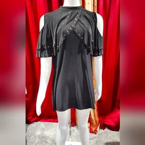 Black dress , open shoulder  copper color dots crossed chest area